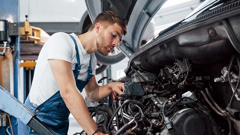 Man repairing a car