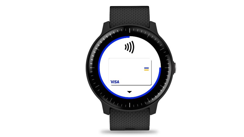 A Garmin watch with a Visa card on a display