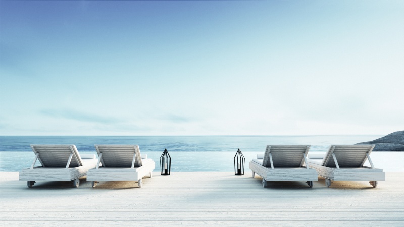 A white beach with deck chairs