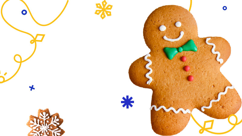 A gingerbread and New Year decorations on the white background