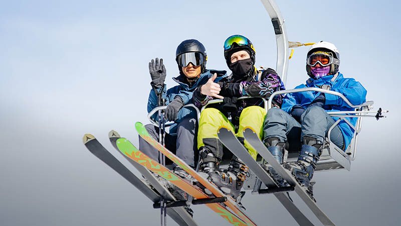 oi-qaragai-activities-800x450 Three skiers elevating on the ski lift